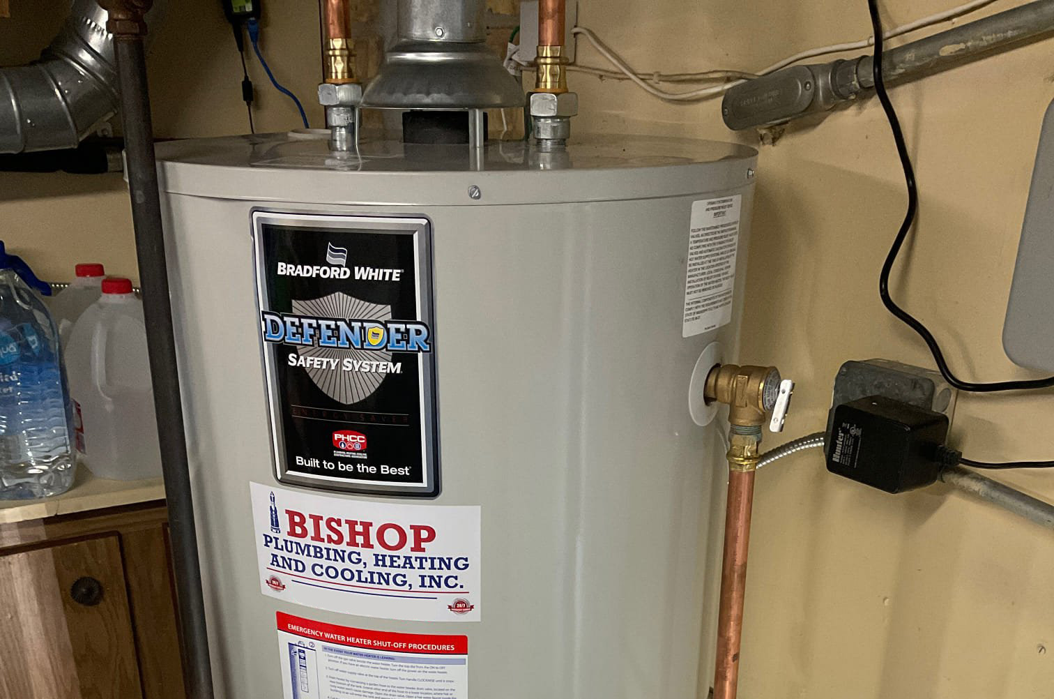 A hot water heater with the Bishop logo on it